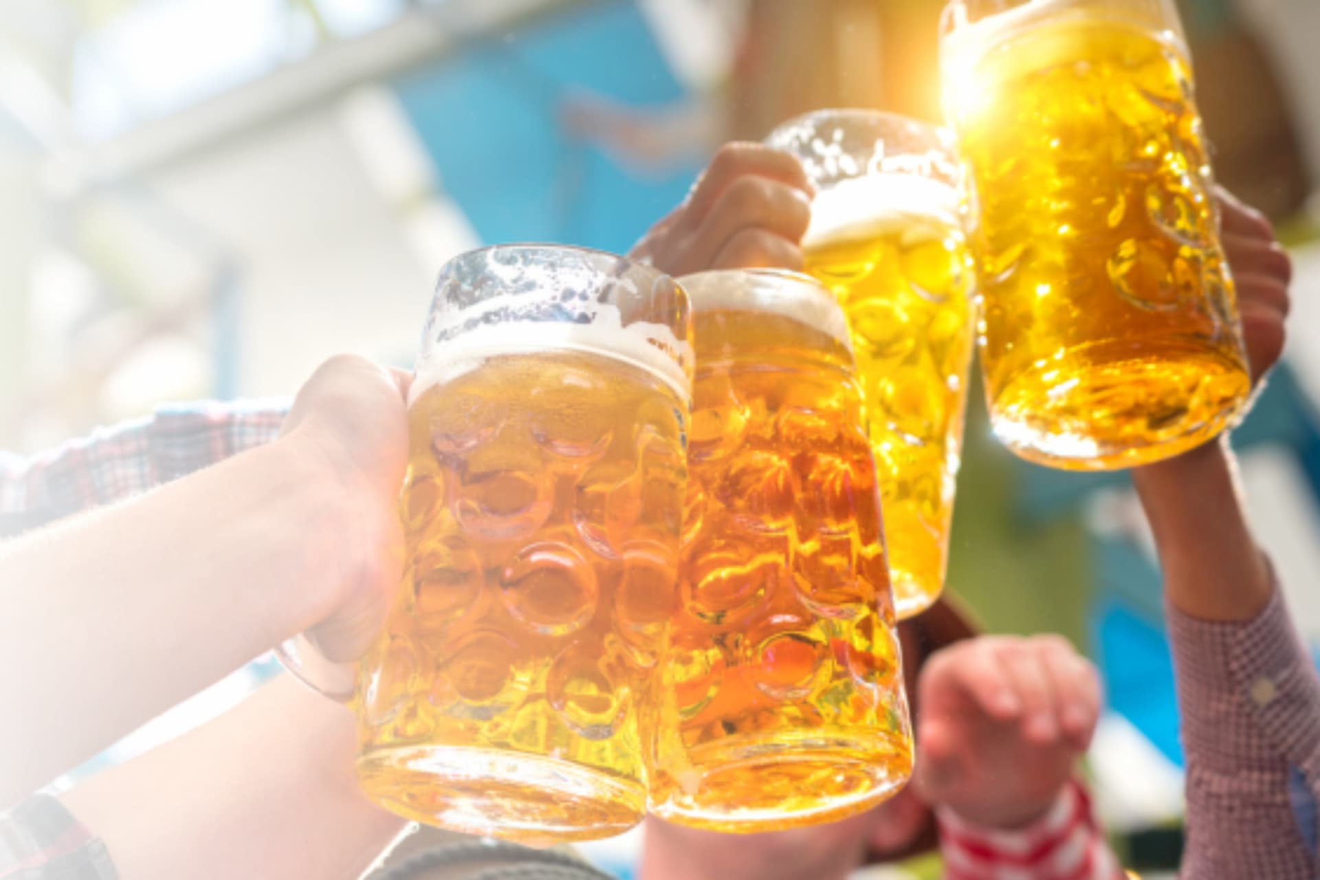 People toasting steins of beer at Oktoberfest